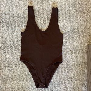 Brown body suit